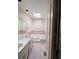 Well-lit bathroom with double vanity, a soaking tub, and a skylight providing natural light at 4006 Bayside Cir, Atlanta, GA 30340