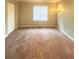 Empty room with neutral paint, carpet, a window, baseboard trim, and closet for your design ideas at 4006 Bayside Cir, Atlanta, GA 30340