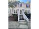 Charming townhome featuring classic architecture, stone accents and manicured landscaping at 4006 Bayside Cir, Atlanta, GA 30340