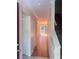 Bright hallway featuring hardwood floors, a closet, and a sliding glass door to a deck area at 4006 Bayside Cir, Atlanta, GA 30340