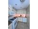 Efficient kitchen featuring gas range, built-in microwave, tile floors and granite countertops at 4006 Bayside Cir, Atlanta, GA 30340