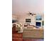 Spacious living room featuring a fireplace, hardwood floors, a ceiling fan, and neutral paint at 4006 Bayside Cir, Atlanta, GA 30340