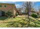 Spacious backyard featuring a deck with stairs, storage shed, and green grass at 4892 Duncan Dr, Powder Springs, GA 30127