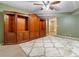 Bonus room features built-in storage cabinets and a large patterned rug at 4892 Duncan Dr, Powder Springs, GA 30127