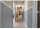 Neutral hallway features trim work and access to multiple rooms at 4892 Duncan Dr, Powder Springs, GA 30127