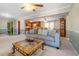 Inviting living room seamlessly connects to the kitchen, featuring a comfortable sofa and stylish decor at 4892 Duncan Dr, Powder Springs, GA 30127