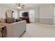 Comfortable living room featuring soft gray walls, large windows for ample light and plush carpeting at 4892 Duncan Dr, Powder Springs, GA 30127