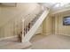 Stairway leading to basement is carpeted and has a white handrail at 4892 Duncan Dr, Powder Springs, GA 30127