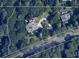 Detailed aerial map view of a property with a long driveway and lush landscaping at 9860 Coleman Rd, Roswell, GA 30075