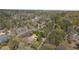Expansive aerial view of a property nestled among mature trees and lush landscaping at 9860 Coleman Rd, Roswell, GA 30075