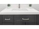 Bathroom vanity with a white countertop and gray cabinet adorned with modern square handles at 9860 Coleman Rd, Roswell, GA 30075