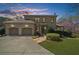 Brick home with attached two-car garage, mature trees, and well-kept lawn at 9860 Coleman Rd, Roswell, GA 30075