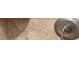 Close up of a silver bathroom sink faucet and light brown countertop at 9860 Coleman Rd, Roswell, GA 30075
