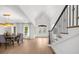 An elegant foyer shows the staircase, dining room, and French doors that flood the space with light at 9860 Coleman Rd, Roswell, GA 30075