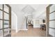 Bright foyer with hardwood floors and staircase, offering an inviting view into the home at 9860 Coleman Rd, Roswell, GA 30075