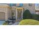 Close-up of front entrance featuring a brick facade, covered entry, and well-maintained landscaping at 9860 Coleman Rd, Roswell, GA 30075