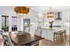 Modern eat-in kitchen featuring white cabinets, marble countertops and stainless steel appliances at 9860 Coleman Rd, Roswell, GA 30075