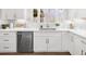 White cabinetry with stainless steel dishwasher and fixtures at 9860 Coleman Rd, Roswell, GA 30075