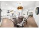 Open-concept kitchen with eat-in dining, stainless appliances and an island with seating at 9860 Coleman Rd, Roswell, GA 30075