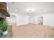 Open concept living room featuring light wood floors, white walls, and recessed lighting at 9860 Coleman Rd, Roswell, GA 30075