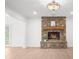 Living room featuring a stone fireplace, light wood floors and lots of recessed lighting at 9860 Coleman Rd, Roswell, GA 30075