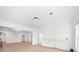 Open concept living room featuring light wood floors, white walls, and recessed lighting at 9860 Coleman Rd, Roswell, GA 30075