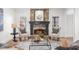 Charming living room featuring a stone fireplace and cozy seating at 9860 Coleman Rd, Roswell, GA 30075