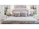 Comfortable bed with decorative pillows in this relaxing bedroom setting at 9860 Coleman Rd, Roswell, GA 30075