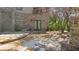 Flagstone patio features stone walls and steps, leading to landscaped yard at 9860 Coleman Rd, Roswell, GA 30075