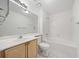 Clean bathroom featuring a vanity, sink, toilet, and tiled shower-tub combo at 112 Bentley Pl, Tucker, GA 30084