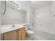 Bathroom featuring a large vanity, toilet, and shower-tub combo with white tile and matching floors at 112 Bentley Pl, Tucker, GA 30084