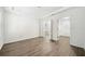 Bright bedroom with wood flooring, tray ceiling and ensuite bath with walk-in closet, offering ample space at 112 Bentley Pl, Tucker, GA 30084