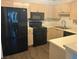 A kitchen showcasing stainless steel appliances, light wood cabinets, and modern laminate flooring at 112 Bentley Pl, Tucker, GA 30084