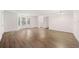 Spacious living room with lots of windows and light wood-look flooring at 112 Bentley Pl, Tucker, GA 30084