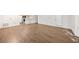 Open-concept living room featuring laminate floors, natural light and access to the kitchen for easy entertaining at 112 Bentley Pl, Tucker, GA 30084