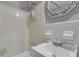 Functional bathroom featuring a shower-tub combo and a vanity sink with modern fixtures at 215 Piedmont Ne Ave # 904, Atlanta, GA 30308