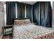 Serene bedroom featuring a comfortable bed, side tables, and blackout curtains at 215 Piedmont Ne Ave # 904, Atlanta, GA 30308