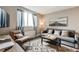 Inviting living room bathed in natural light, featuring a comfortable seating area and decor at 215 Piedmont Ne Ave # 904, Atlanta, GA 30308