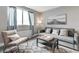 Cozy living room with neutral tones, stylish decor, and lots of natural light at 215 Piedmont Ne Ave # 904, Atlanta, GA 30308