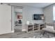 Modern living area with a sliding door and view into a separate room at 215 Piedmont Ne Ave # 904, Atlanta, GA 30308