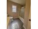 Neutral bathroom featuring patterned floor, bathtub and shower combo at 3348 Concord Se Cor, Conyers, GA 30013