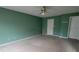 Green bedroom with neutral carpet and a ceiling fan with white doors at 3348 Concord Se Cor, Conyers, GA 30013