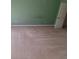 Green bedroom featuring neutral carpet with a partial view of a white door at 3348 Concord Se Cor, Conyers, GA 30013
