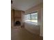 Living room features a brick fireplace and a large window with views of the outdoors at 3348 Concord Se Cor, Conyers, GA 30013