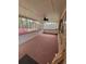 Sunroom featuring a red carpet, white walls and windows at 3348 Concord Se Cor, Conyers, GA 30013