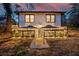 Backyard view of the home with dual umbrella covered patios and string lights for entertainment at 503 Mcwilliams Se Rd, Atlanta, GA 30315