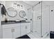 Modern bathroom with a glass-enclosed shower, double sinks, and elegant fixtures at 503 Mcwilliams Se Rd, Atlanta, GA 30315