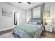 Cozy bedroom showcases a comfortable queen bed, a nightstand, and decorative wall art at 503 Mcwilliams Se Rd, Atlanta, GA 30315