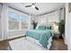 Bright bedroom features hardwood floors, ceiling fan, and large windows with natural light at 503 Mcwilliams Se Rd, Atlanta, GA 30315