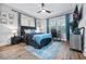 Cozy bedroom featuring a comfortable bed, a workspace, and natural light at 503 Mcwilliams Se Rd, Atlanta, GA 30315